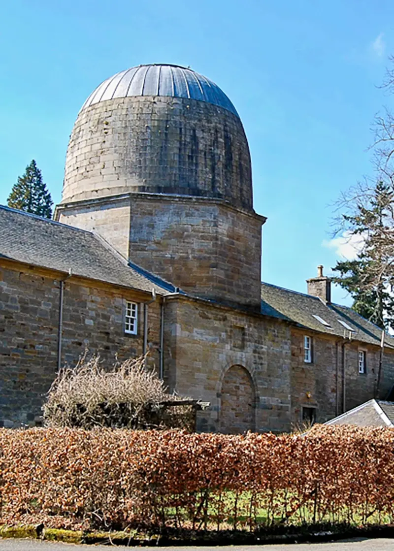 A photograph of the replica of Arthur's O'on on the roof of the stable-blocks at Penicuik House, Midlothian, Scotland.